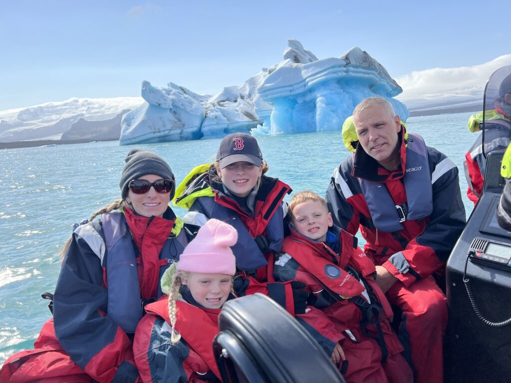 family at Jokulsarlon glacier lagoon in iceland. Summer was the best time of year to visit Iceland for what we were looking for.