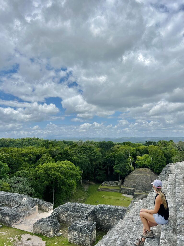 Caracol Mayan Ruins in Belize. SItting at the top of the ruins after climbing them.